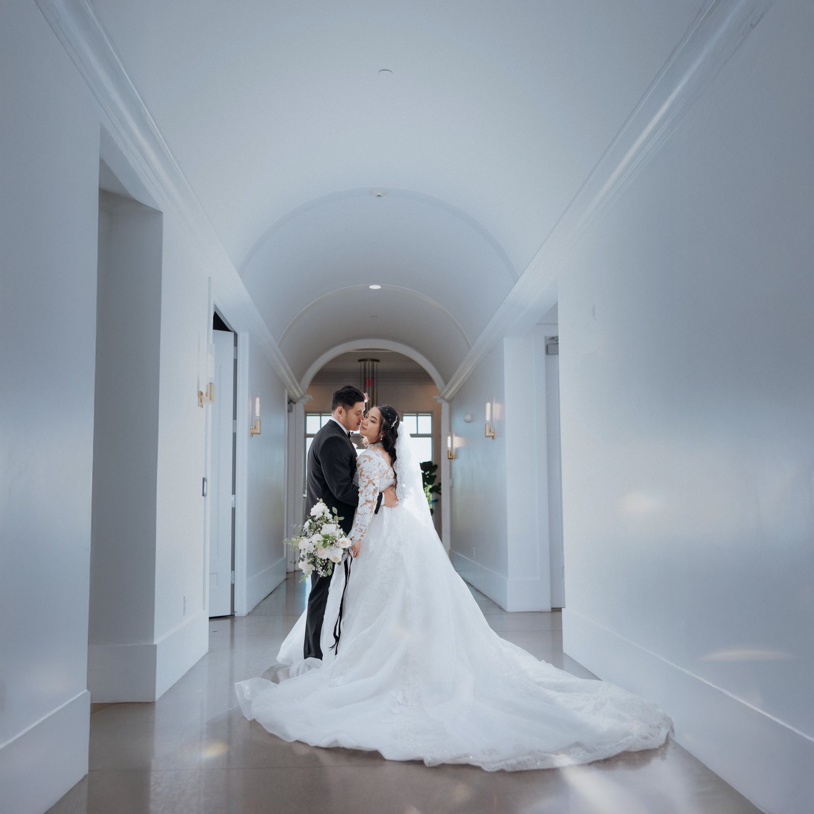 Bride and groom walking together at sunset in Omaha